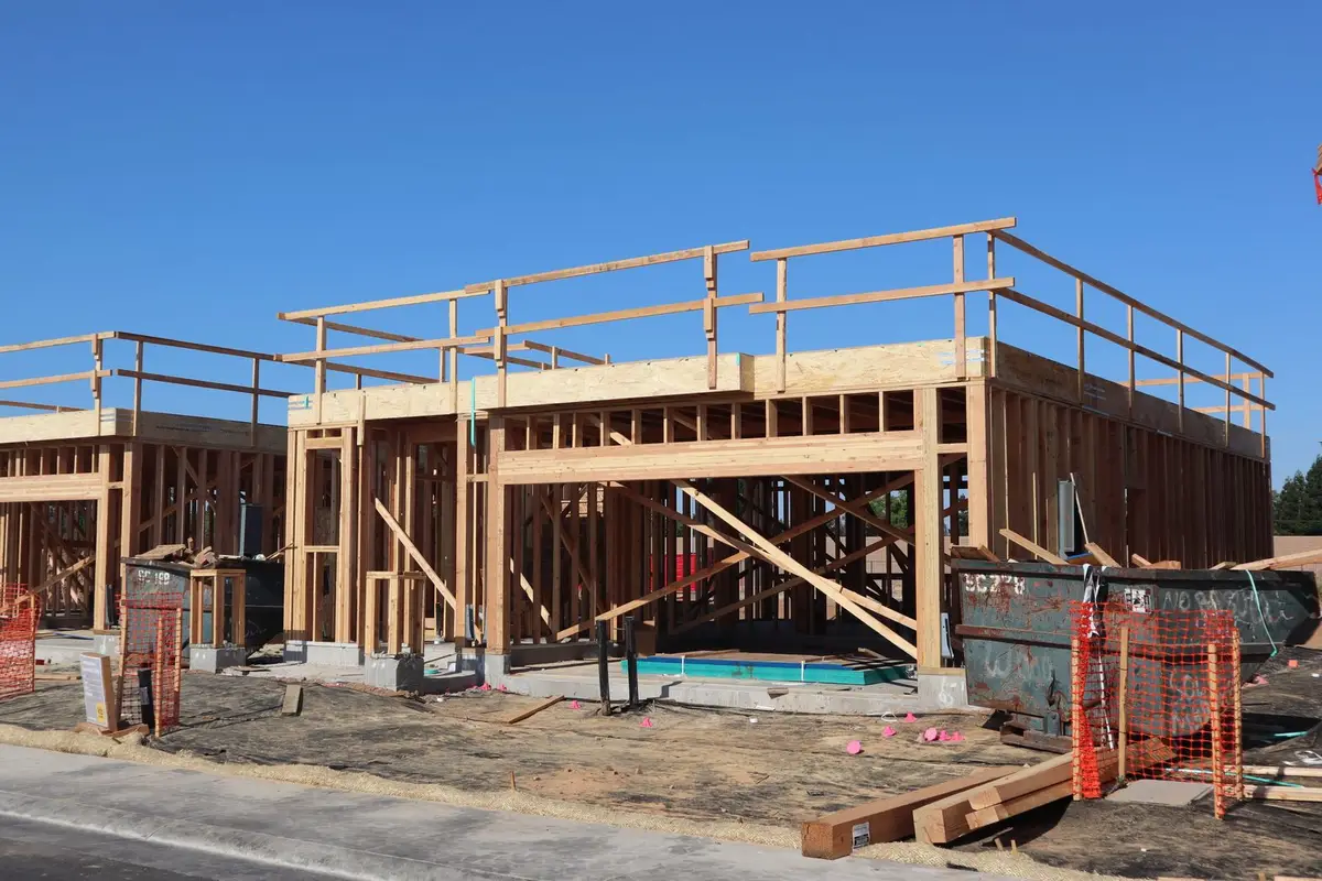 New residential framing on a concrete slab foundation at a construction site